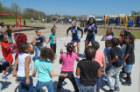 Elementary school students decided to show the ODU cheerleaders some of their moves. Photo Chuck Thomas/ODU